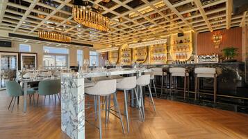 3 bars/lounges, sports bar, rooftop bar