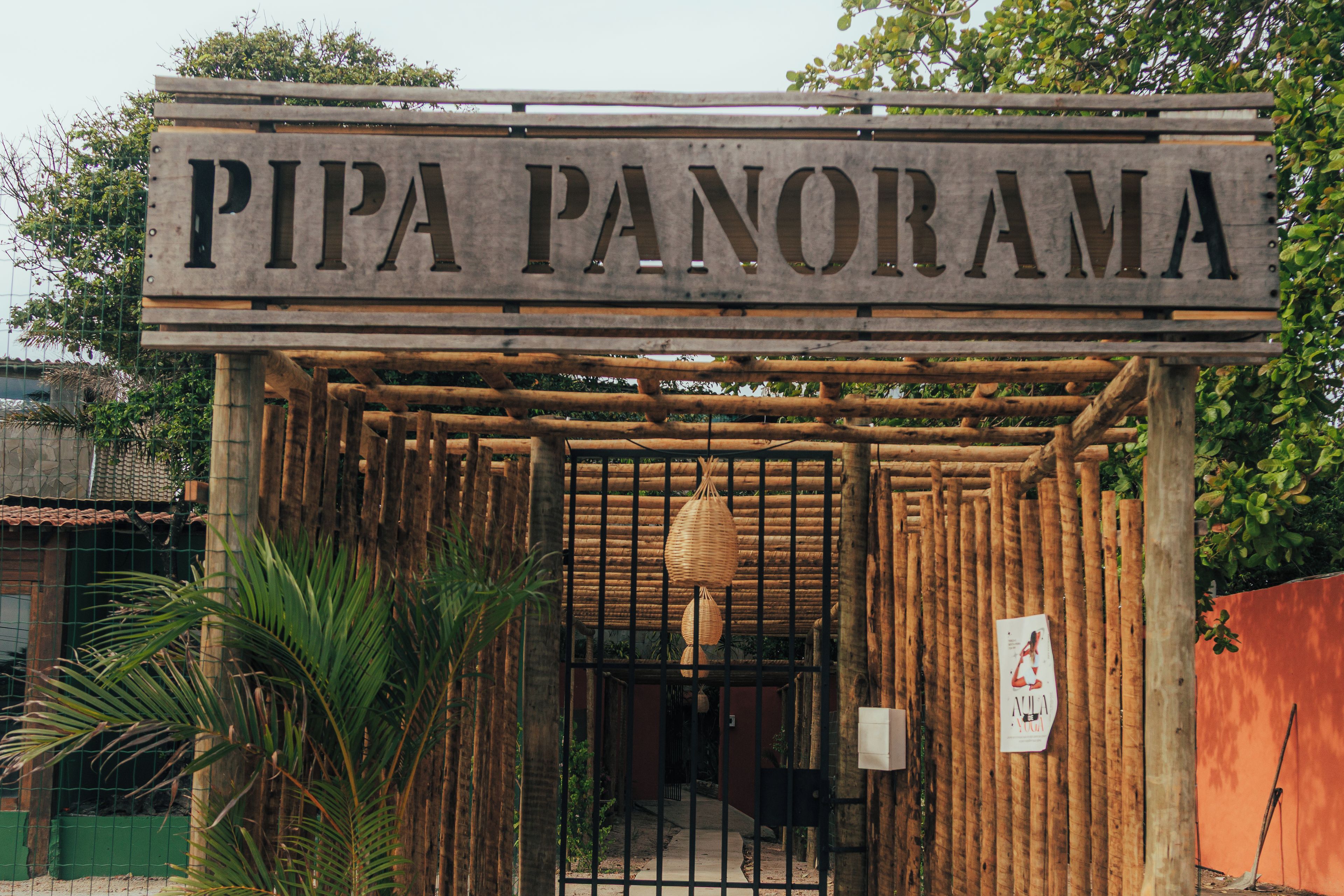 A wooden entrance with a sign reading 'PIPA PANORAMA'.
