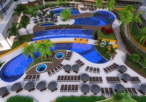 A multi-level pool area with various water features, sun loungers, and palm trees. - Resort solar das águas  (Olímpia)