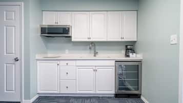 Microwave, stovetop, coffee/tea maker, cookware/dishes/utensils