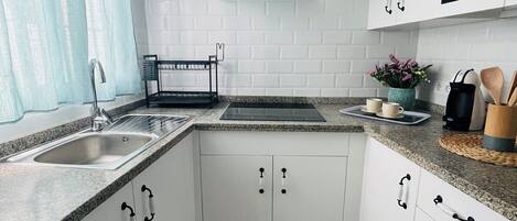 Fridge, microwave, stovetop, coffee/tea maker