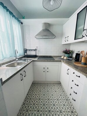 Fridge, microwave, stovetop, coffee/tea maker