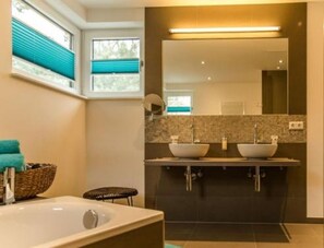 Jetted tub, hair dryer, towels, soap