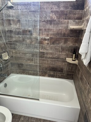 Shower, hair dryer, towels, toilet paper