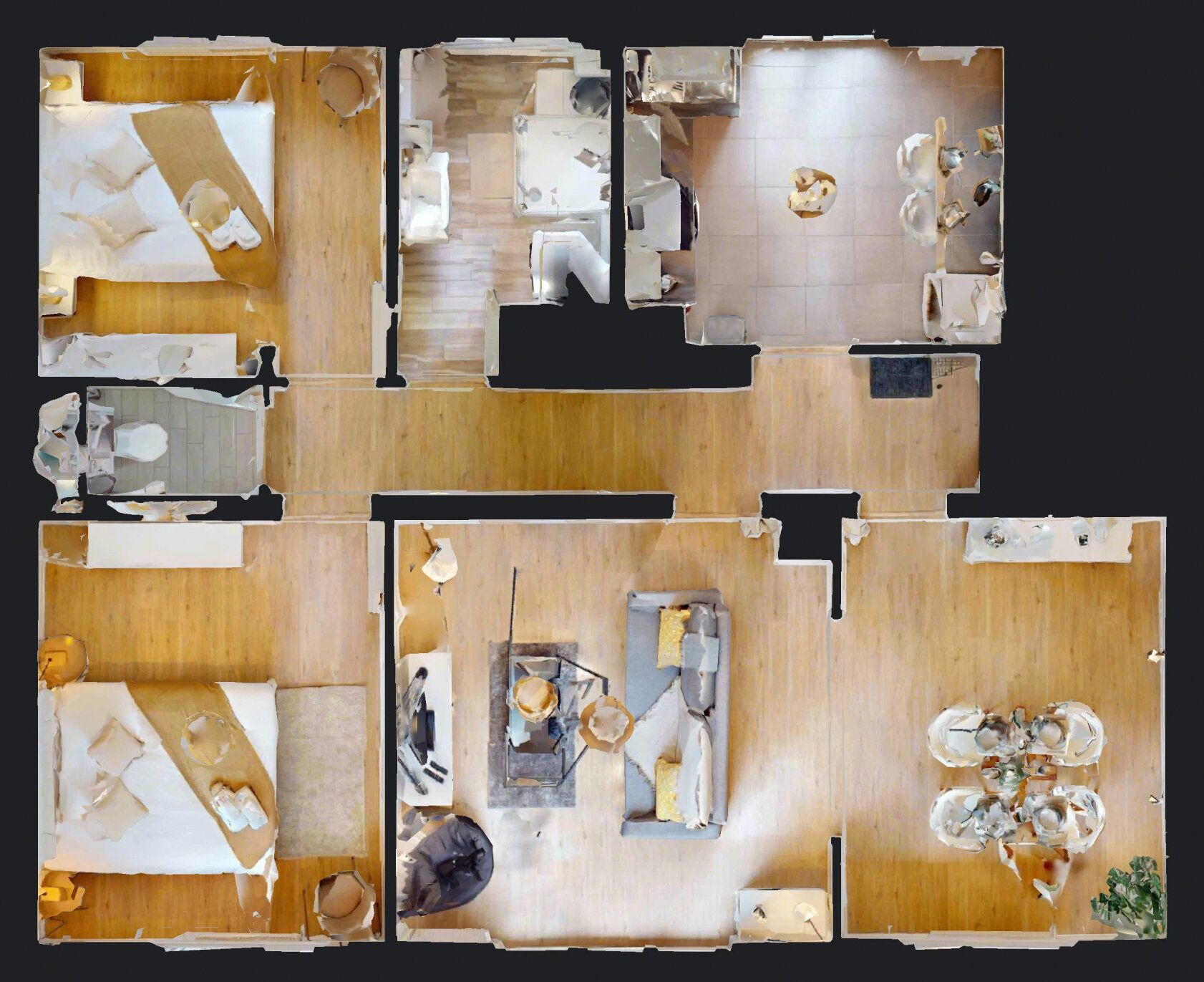 A hotel layout with multiple rooms, a central area with a seating arrangement, and a small outdoor space.