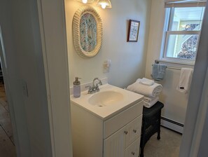 Shower, towels, soap, toilet paper