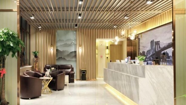 A modern reception area with a marble counter, leather seating, and a cityscape mural. - Super 8 Plus Hotel (Beijing Tiananmen Square Qianmen Pedestrian Street) (Beijing)