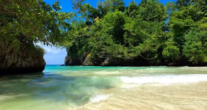 70s-tastic charm in acres of lawns and gardens overlooking a stunning island