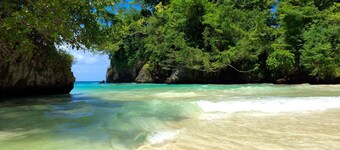 70s-tastic charm in acres of lawns and gardens overlooking a stunning island