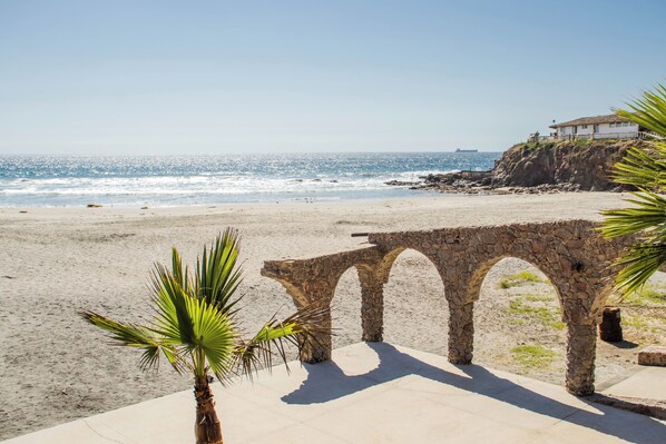 On the beach, sun-loungers