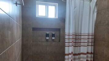 Shower, towels, soap, toilet paper