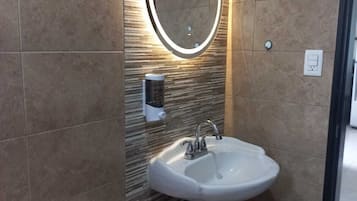 Shower, towels, soap, toilet paper