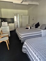 Comfort Triple Room, Multiple Beds, Private Bathroom, Garden View | Down comforters, free minibar items, desk, laptop workspace