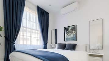 4 chambres, coffres-forts dans les chambres, fer et planche à repasser