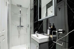 Shower, eco-friendly toiletries, hair dryer, bidet