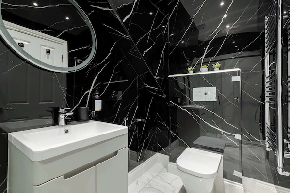 Shower, eco-friendly toiletries, hair dryer, bidet