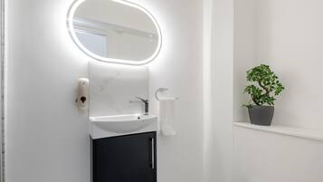 Shower, eco-friendly toiletries, hair dryer, bidet