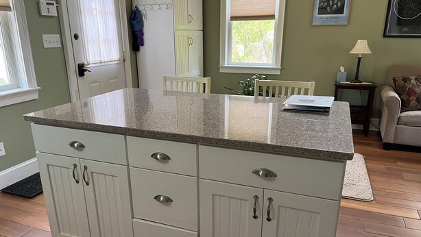 A kitchen with white cabinetry, granite countertops, and a window with blinds. - Charming loft cottage in tranquil Germantown with WiFi, AC (Germantown)