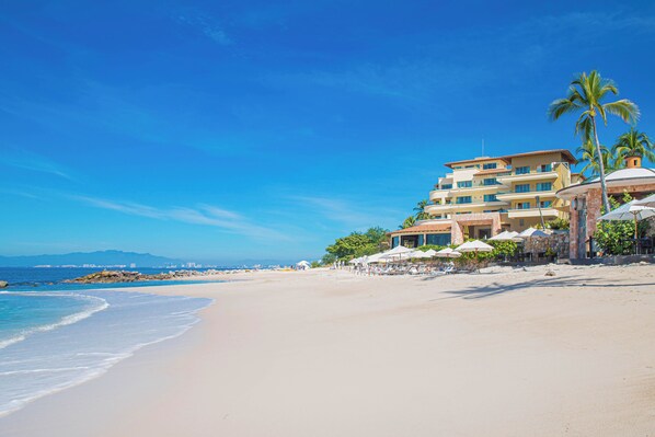 On the beach, sun loungers, beach towels