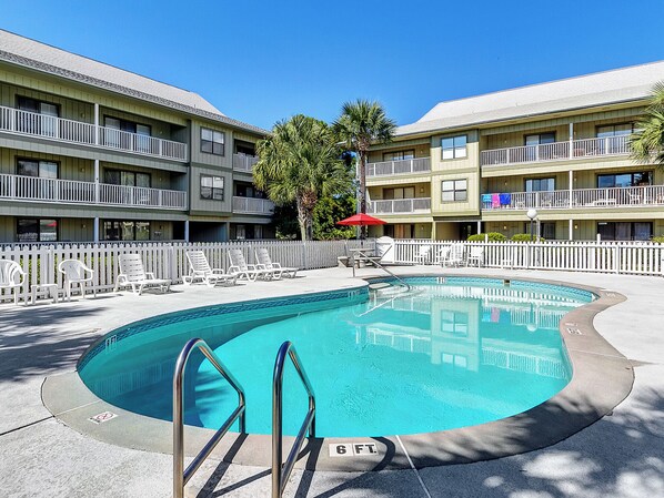 A swimming pool with a 6 ft depth marker, surrounded by lounge chairs and a white picket fence. - 2 Bikes! Location!Walk to beach & Bike to Seaside! (Santa Rosa Beach)