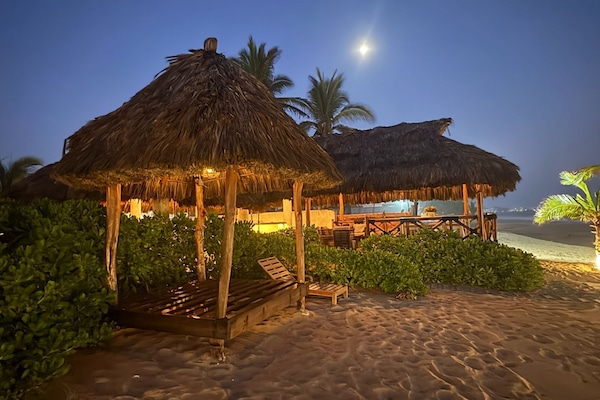 On the beach, free beach cabanas, beach umbrellas, beach towels