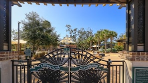 A gated entrance to Adventure Playground with a clear view of the playground area.