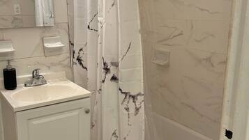 Hair dryer, towels, soap, shampoo