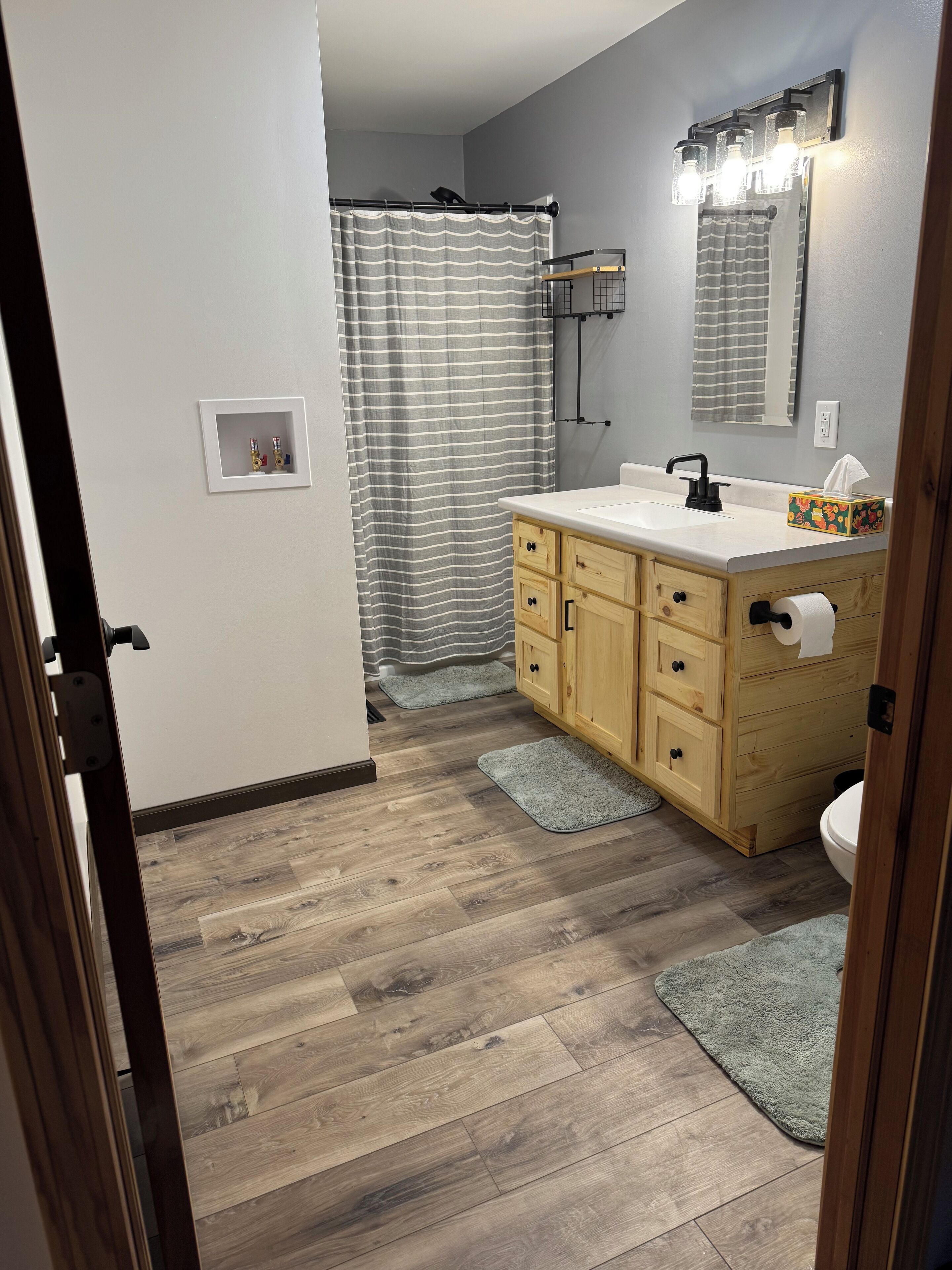 Shower, hair dryer, towels, toilet paper