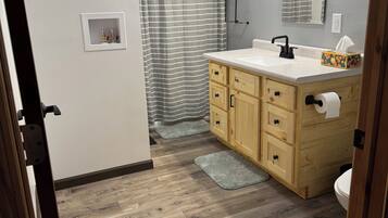 Shower, hair dryer, towels, toilet paper