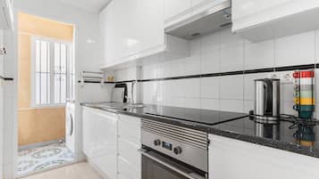 Fridge, microwave, stovetop, cookware/dishes/utensils
