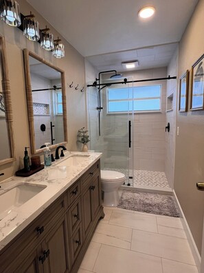 Shower, towels, soap, toilet paper