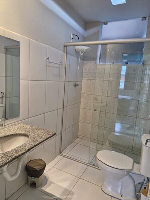 Shower, hair dryer, towels, toilet paper