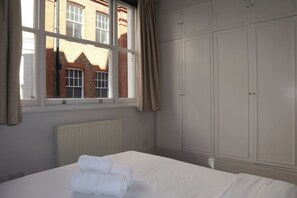 1 bedroom, desk, iron/ironing board, travel crib