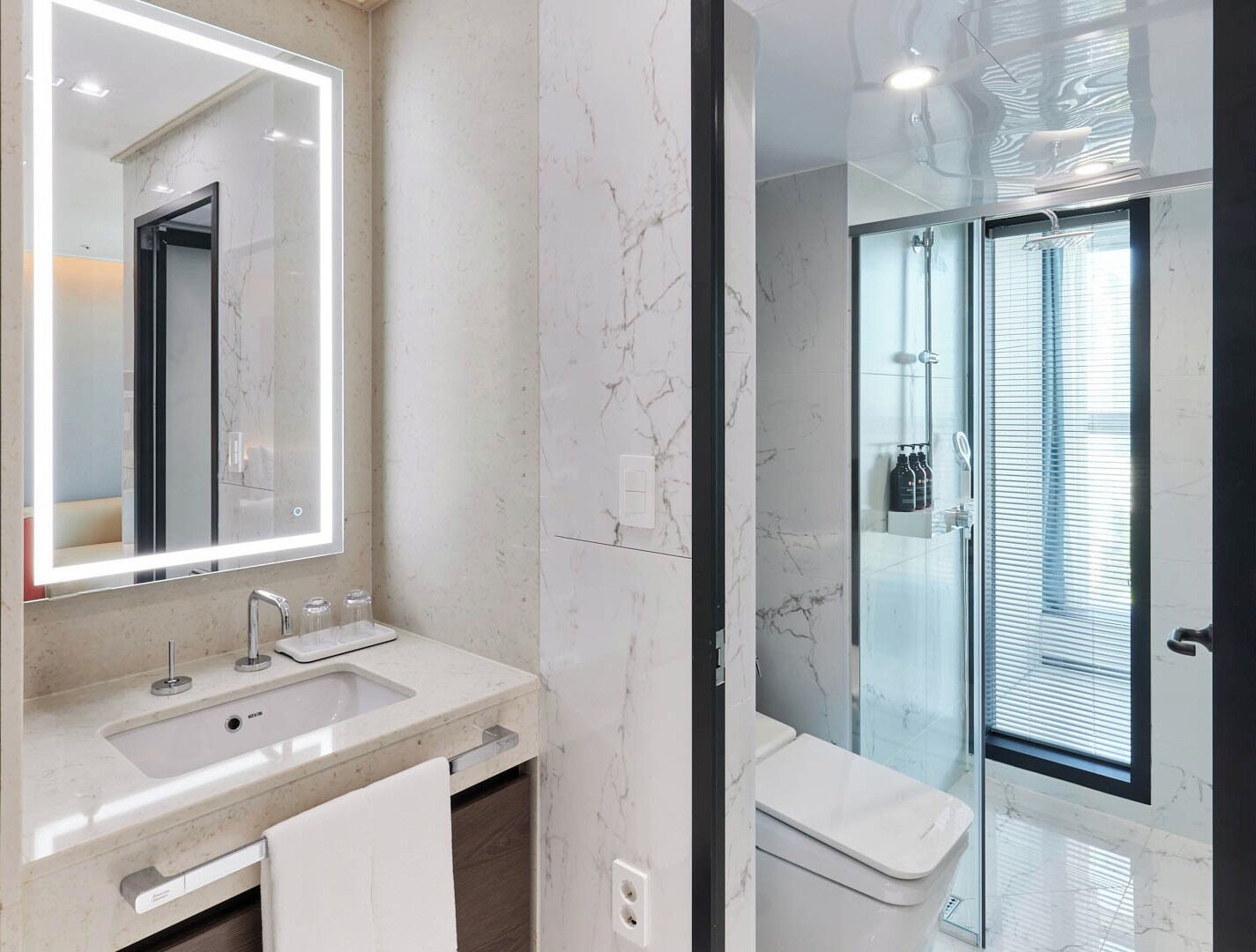 Shower, hair dryer, slippers, towels