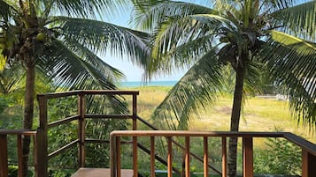 Quarto casal luxo, sacada, vista para a praia | Vista para a água