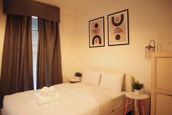 1 bedroom, desk, iron/ironing board, travel crib