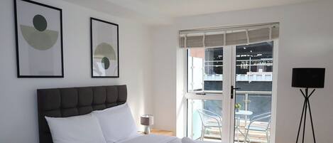 1 bedroom, desk, iron/ironing board, travel crib