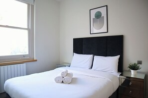 1 bedroom, desk, iron/ironing board, travel cot