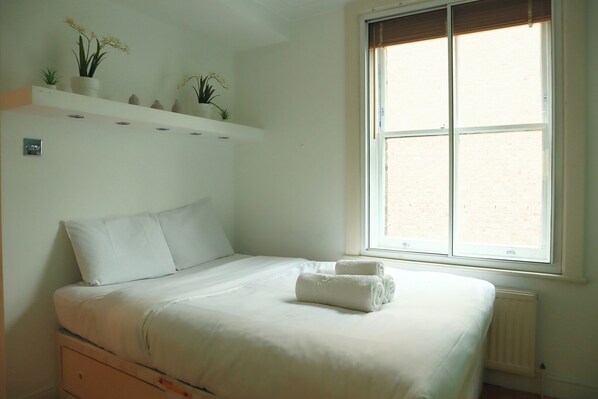 1 bedroom, desk, iron/ironing board, travel crib