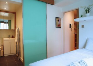 1 bedroom, desk, iron/ironing board, travel crib