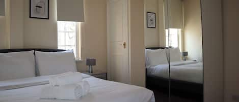 1 bedroom, desk, iron/ironing board, travel crib