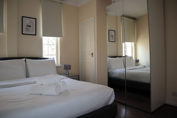 1 bedroom, desk, iron/ironing board, travel cot