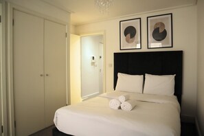 1 bedroom, desk, iron/ironing board, travel cot