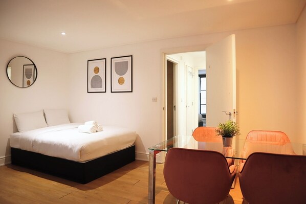 1 bedroom, desk, iron/ironing board, travel crib