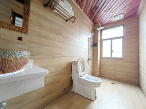 Shower, hair dryer, slippers, towels