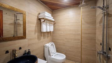 Shower, hair dryer, slippers, towels