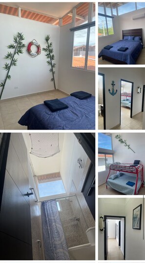 Cozy retreat with a large bed, window offering a view of the outdoors, and a separate area with a bunk bed.