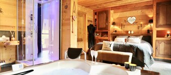 Romantic chalet with a hot tub and a steam room
