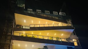 A multi-story building with a restaurant named "Gulmohar" on the ground floor and "AAPL" on the second floor. - Gulmohar guest house (Balasore)