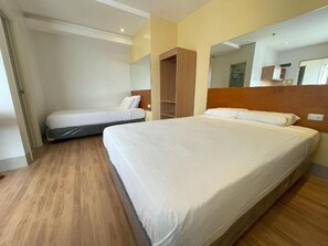 Family Twin Room, City View | Desk, free WiFi, bed sheets - Almond Suites by Hiverooms (Cebu City)
